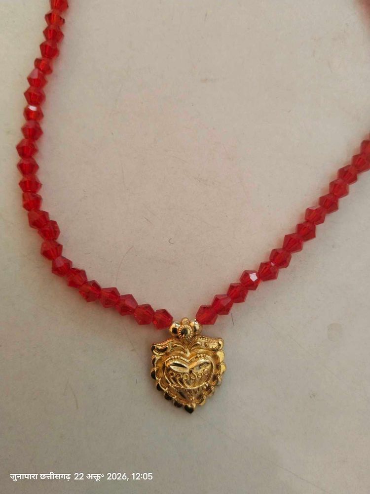 Red Beaded Necklace with Gold Pendant