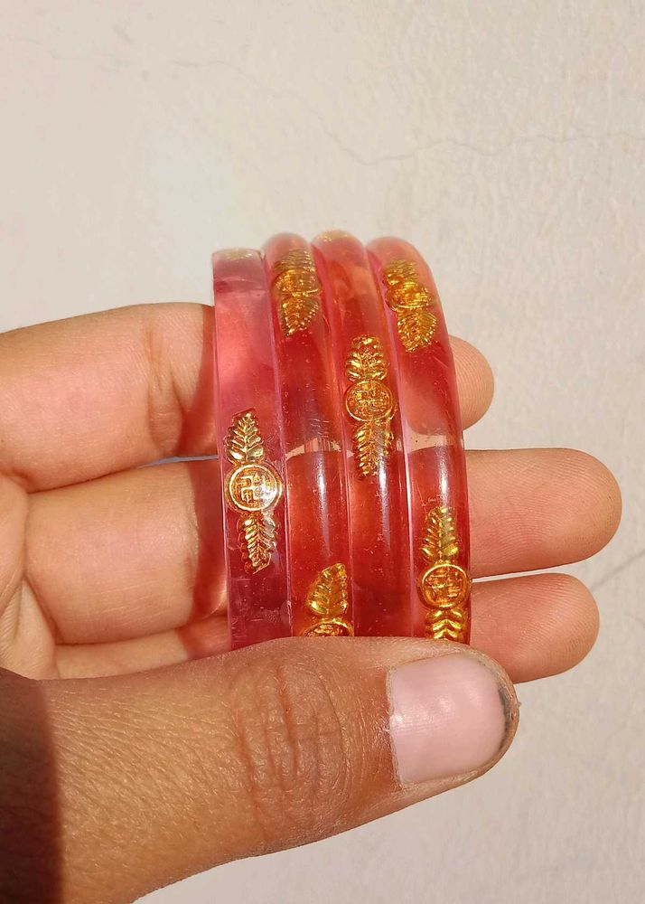 Elegant Red Bangles with Gold Accents