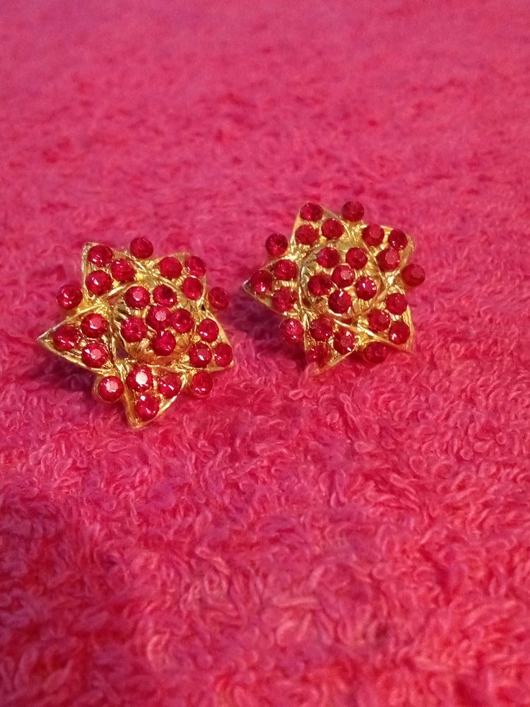 Gold Coloured Studs With Red Stones