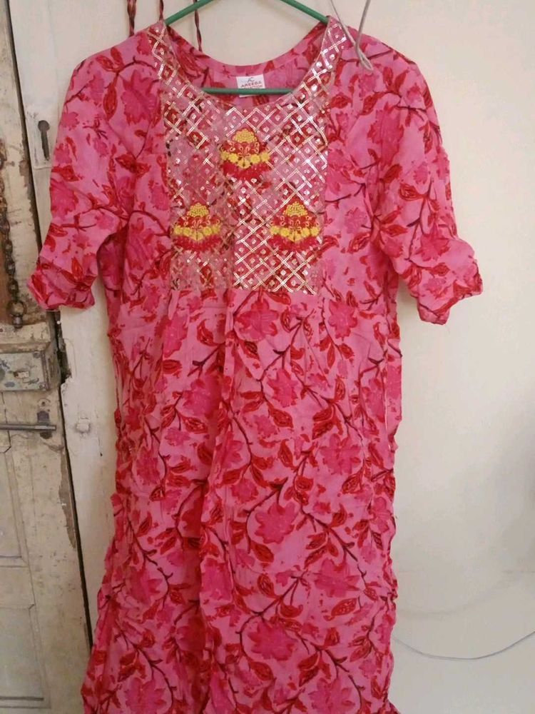 Vibrant Pink Floral Kurta with Embellished Necklin