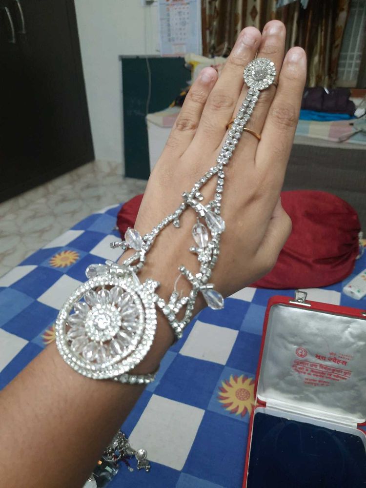 combo of 3- hand jewelry, hoops, 2 hair cli