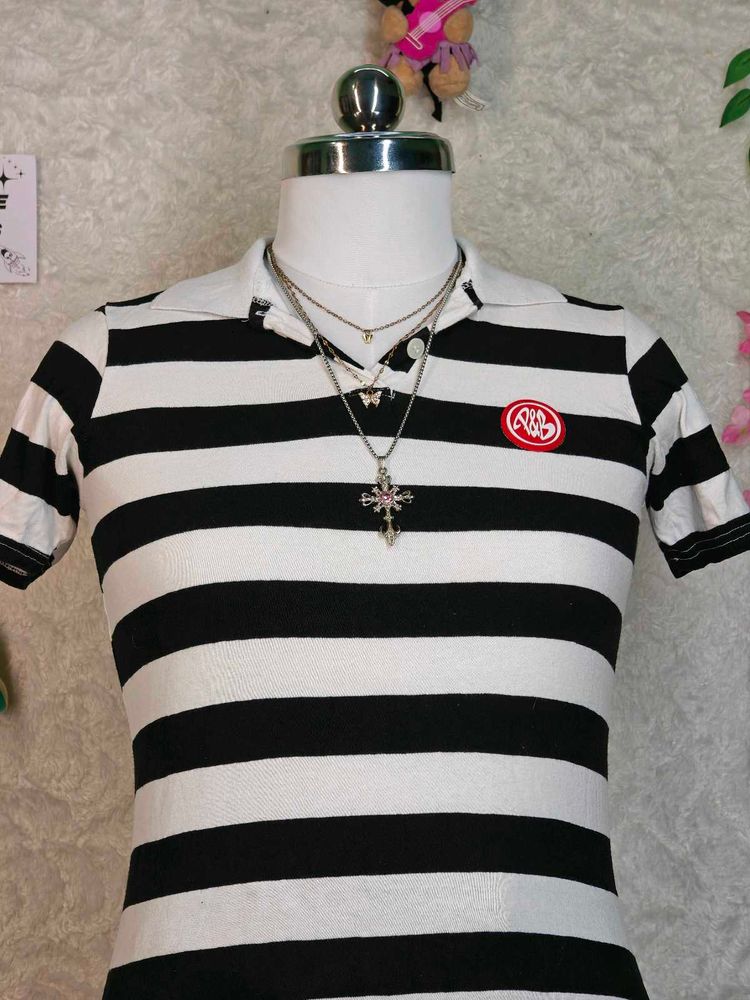 Women's black and white striped polo tee