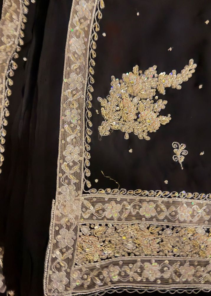 Elegant Black Saree with Intricate Embellishments